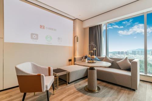 Imagen general del Hotel Jun Ming Happy World Yishang PLUS, Guangzhou. Foto 13