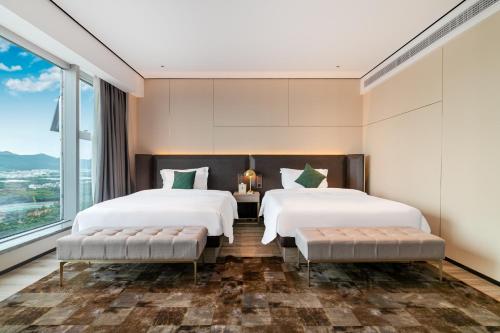 Imagen general del Hotel Jun Ming Happy World Yishang PLUS, Guangzhou. Foto 14