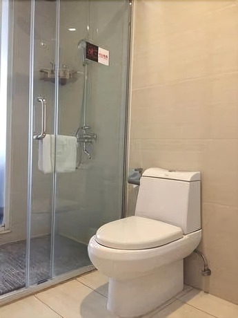 Imagen de la habitación del Hotel Junfu. Foto 9