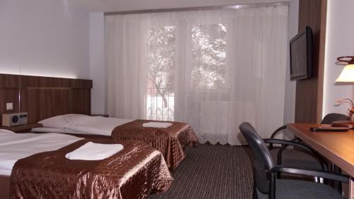 Imagen de la habitación del Hotel Junior, Zamość. Foto 9