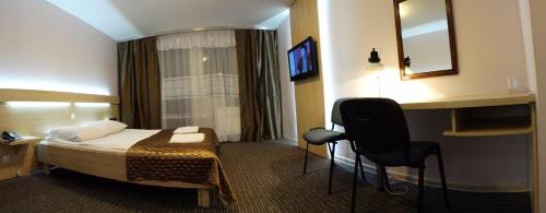 Imagen de la habitación del Hotel Junior, Zamość. Foto 10