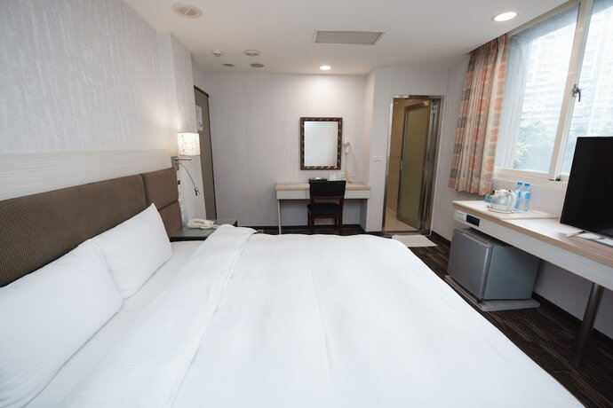 Imagen de la habitación del Hotel Junli. Foto 17