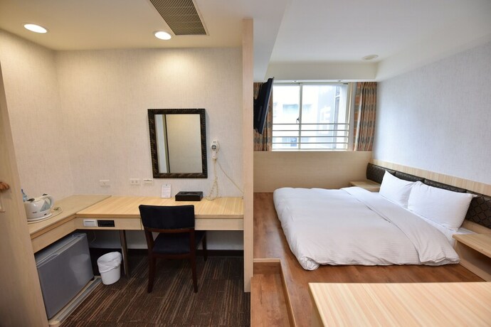 Imagen de la habitación del Hotel Junli. Foto 19