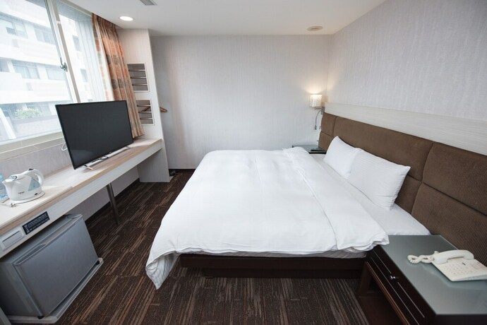 Imagen de la habitación del Hotel Junli. Foto 21