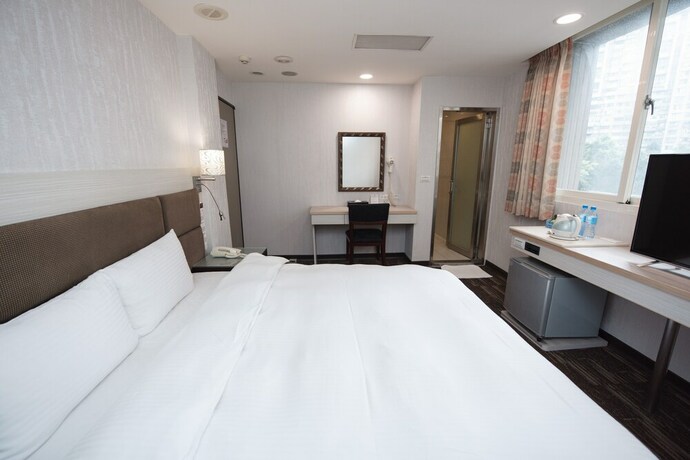 Imagen de la habitación del Hotel Junli. Foto 24