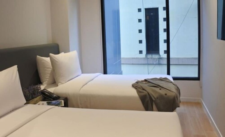 Imagen de la habitación del Hotel Juno Tanah Abang Jakarta. Foto 5