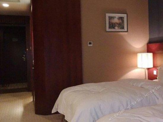 Imagen de la habitación del Hotel Junyi Wangchao. Foto 2