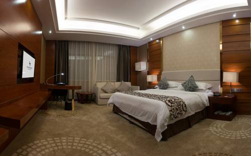 Imagen de la habitación del Hotel Junyue Internation. Foto 1