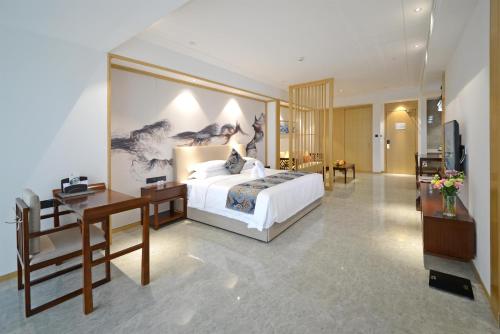 Imagen de la habitación del Hotel Juzhi Herton. Foto 9