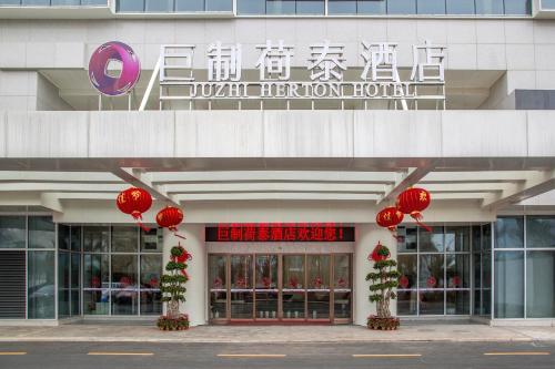 Imagen de la habitación del Hotel Juzhi Herton. Foto 10
