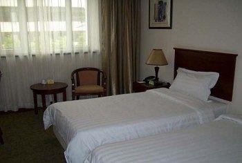 Imagen de la habitación del Hotel KAIBO HOTEL. Foto 5