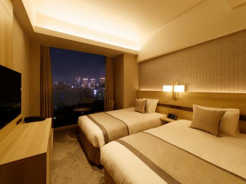 Imagen de la habitación del Hotel KEIHAN TSUKIJI GINZA GRANDE. Foto 8