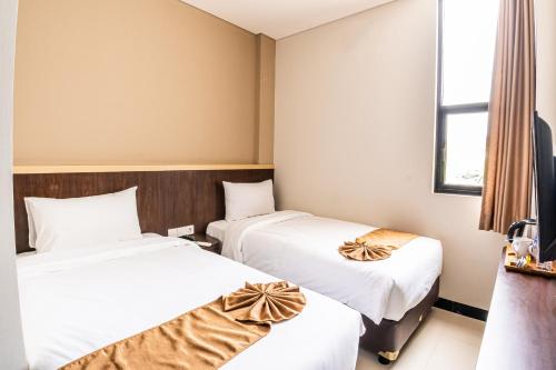 Imagen de la habitación del Hotel KIYANA HOTEL SEMARANG. Foto 17