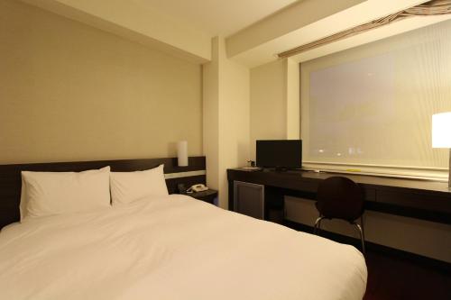 Imagen de la habitación del Hotel KOKO HOTEL Sendai Kotodai Park. Foto 15