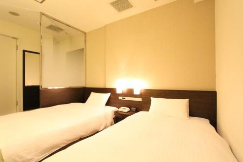 Imagen de la habitación del Hotel KOKO HOTEL Sendai Kotodai Park. Foto 17