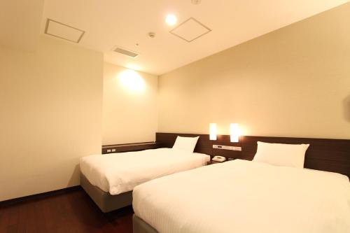 Imagen de la habitación del Hotel KOKO HOTEL Sendai Kotodai Park. Foto 19