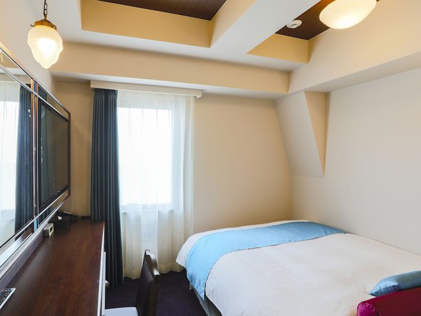 Imagen de la habitación del Hotel KOKO Ikebukuro. Foto 11