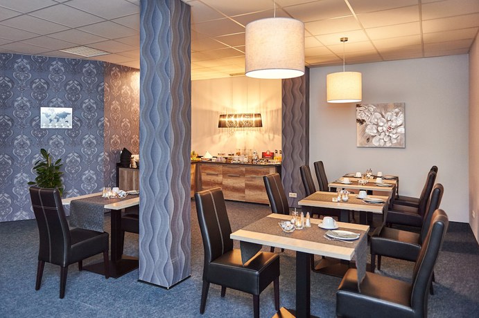 Imagen del bar/restaurante del Hotel KOMM\' IN. Foto 3