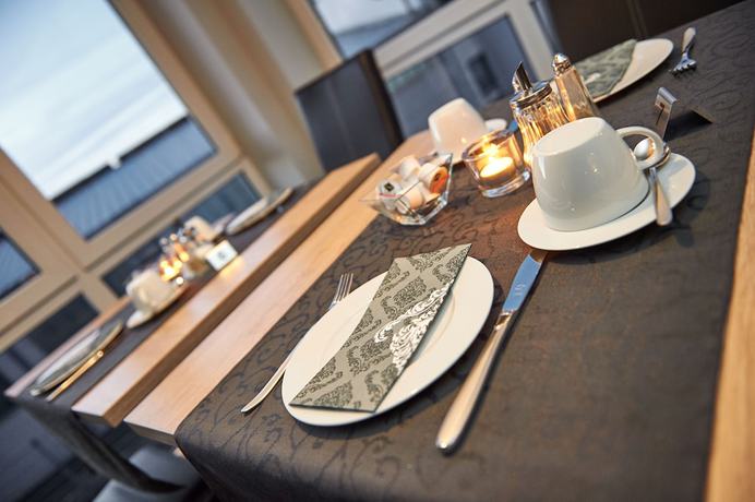 Imagen del bar/restaurante del Hotel KOMM\' IN. Foto 5