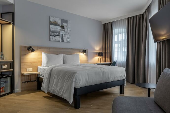 Imagen de la habitación del Hotel KONTRAKT Boutique. Foto 13