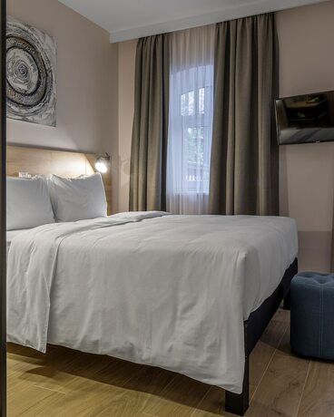Imagen de la habitación del Hotel KONTRAKT Boutique. Foto 16