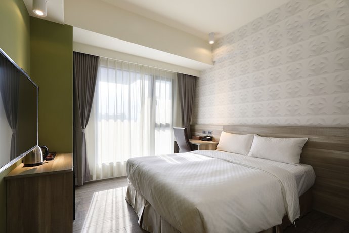 Imagen de la habitación del Hotel KUN Tour Feng Chai. Foto 10