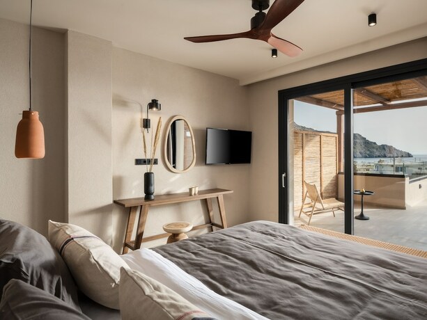 Imagen de la habitación del Hotel KYMĀNI Boutique and Suites. Foto 11