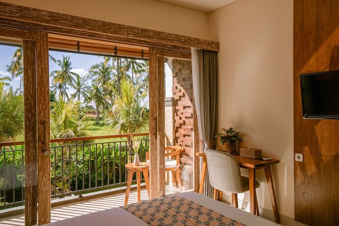 Imagen de la habitación del Hotel Kahayana Suites. Foto 18