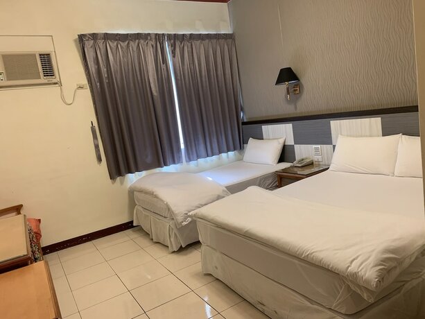 Imagen de la habitación del Hotel Kai Xin. Foto 11