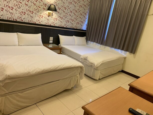 Imagen de la habitación del Hotel Kai Xin. Foto 12