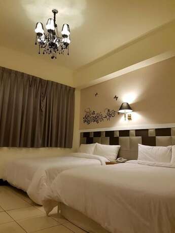 Imagen de la habitación del Hotel Kai Xin. Foto 14