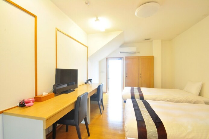 Imagen de la habitación del Hotel Kaiho Fusaki Annex. Foto 24