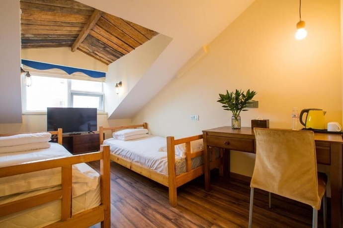 Imagen de la habitación del Hotel KaiyueHostel. Foto 6