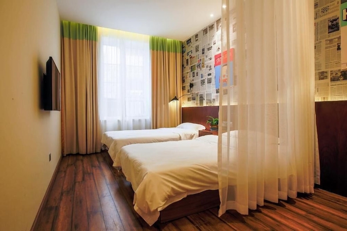Imagen de la habitación del Hotel KaiyueHostel. Foto 14