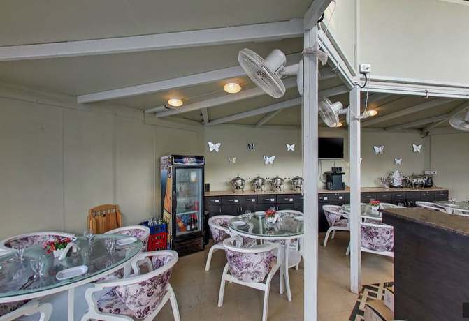 Imagen del bar/restaurante del Hotel Kalki Resort and Cottages baga. Foto 6