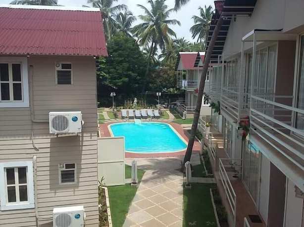Imagen de la piscina del Hotel Kalki Resort and Cottages baga. Foto 20