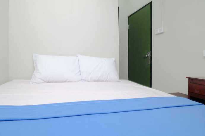 Imagen de la habitación del Hotel Kamar Keluarga Bandara IV Syariah. Foto 18