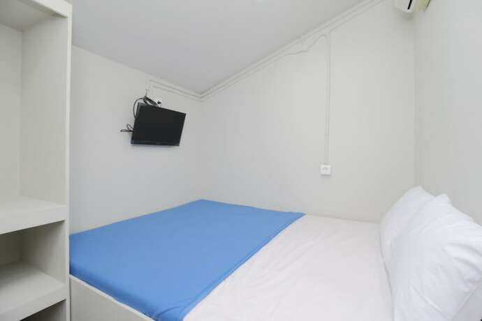 Imagen de la habitación del Hotel Kamar Keluarga Bandara IV Syariah. Foto 19