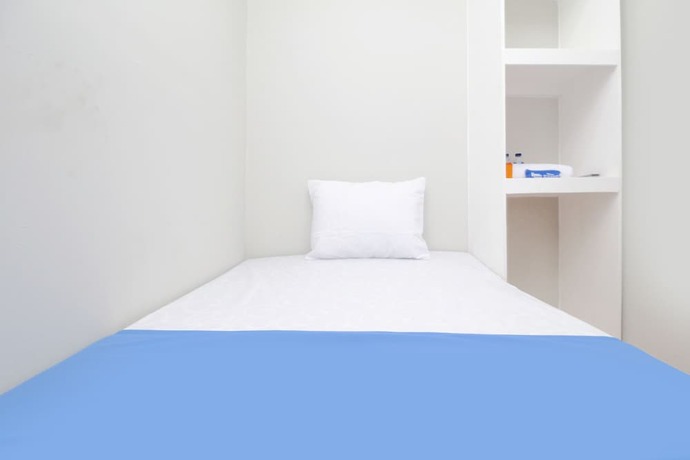 Imagen de la habitación del Hotel Kamar Keluarga Bandara Mas Syariah. Foto 19