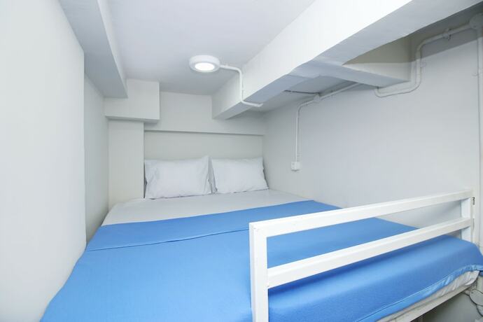 Imagen de la habitación del Hotel Kamar Keluarga Bandara VII Syariah. Foto 14