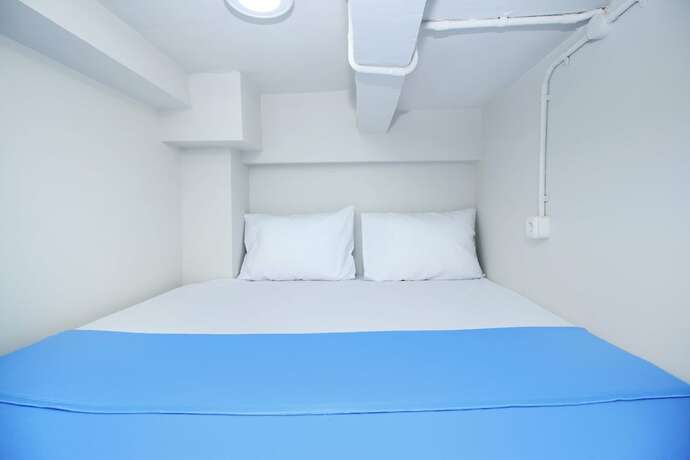 Imagen de la habitación del Hotel Kamar Keluarga Bandara VII Syariah. Foto 15