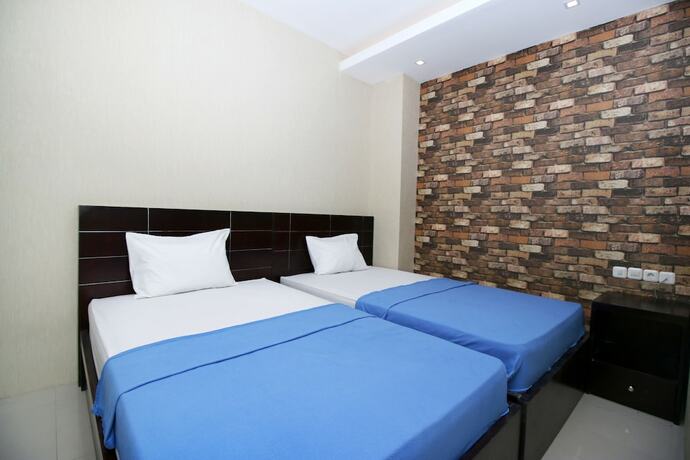 Imagen de la habitación del Hotel Kamar Keluarga Kampung Bali III Syariah. Foto 17