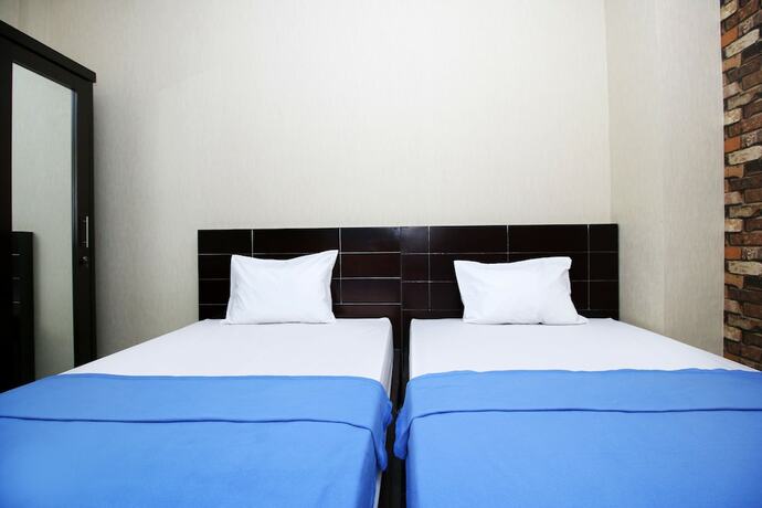 Imagen de la habitación del Hotel Kamar Keluarga Kampung Bali III Syariah. Foto 18