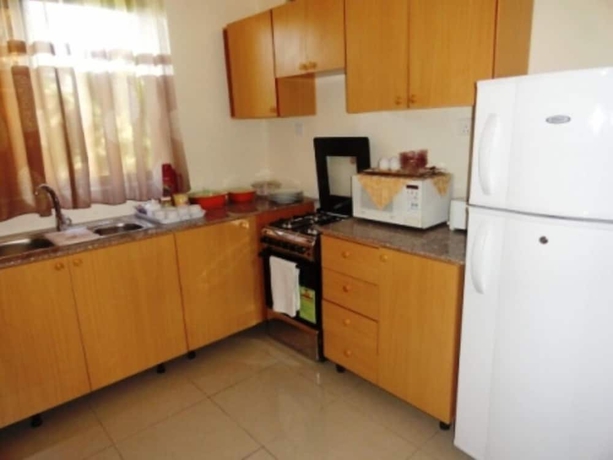 Imagen de la habitación del Hotel Kami Executive Apartments. Foto 10