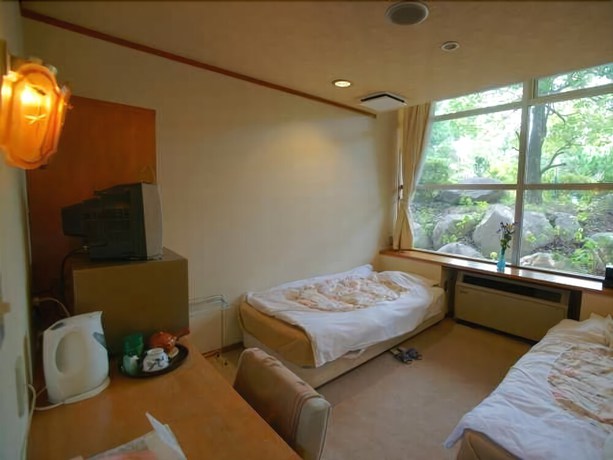 Imagen de la habitación del Hotel Kaminoyu Onsen. Foto 14