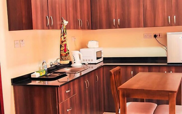 Imagen de la habitación del Hotel Kampala Suites. Foto 10