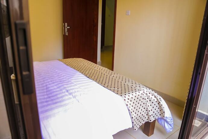 Imagen de la habitación del Hotel Kampala Suites. Foto 11