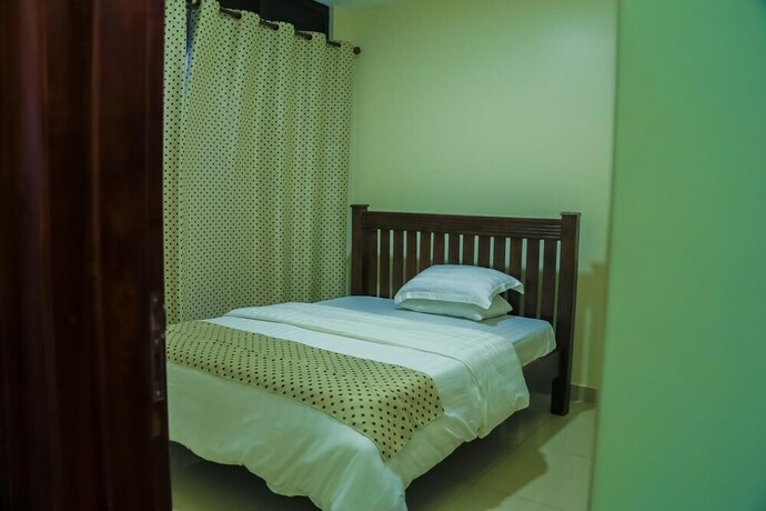 Imagen de la habitación del Hotel Kampala Suites. Foto 14