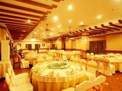 Imagen del bar/restaurante del Hotel Kangle Garden Resort Wanning. Foto 4