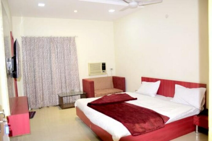 Imagen de la habitación del Hotel Kanha Ujjain. Foto 19